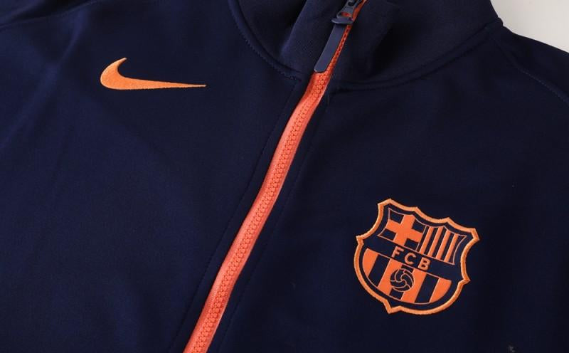 BARCELONA FATO DE TREINO 2526 – UNISSEX  AZUL MARINHO E LARANJA