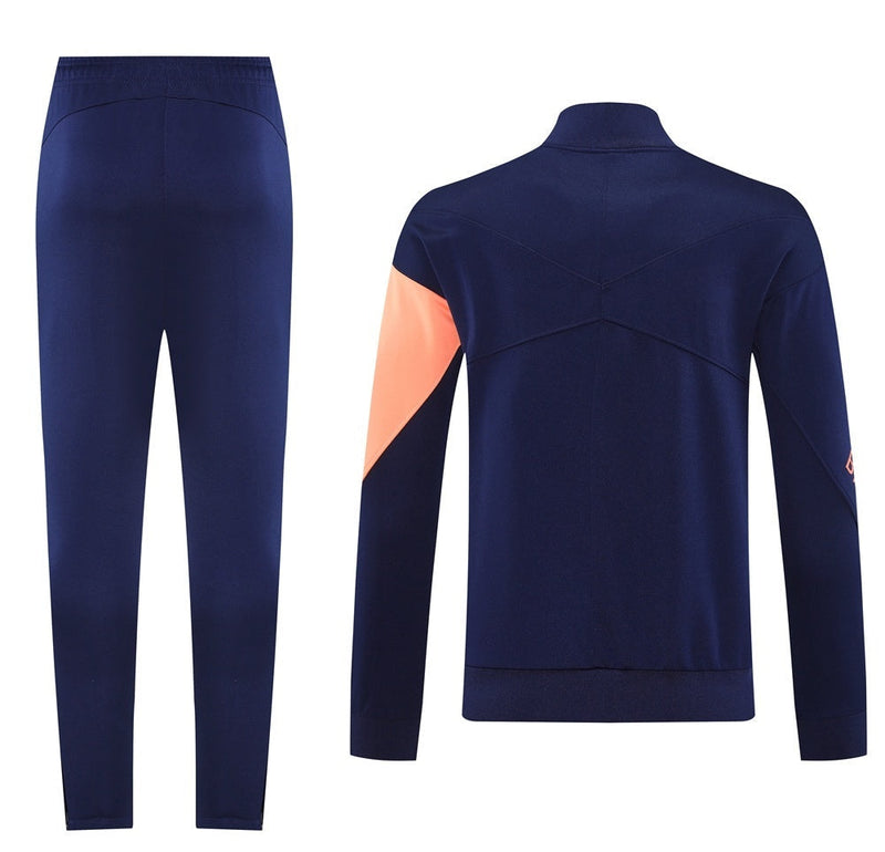 BARCELONA FATO DE TREINO 2526 – UNISSEX  AZUL MARINHO E LARANJA